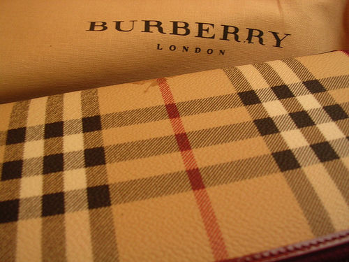 What economic decline Burberry reports 20 percent upturn in last